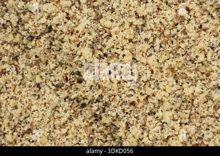 Macro crushed walnut kernels top view. Stock Photo