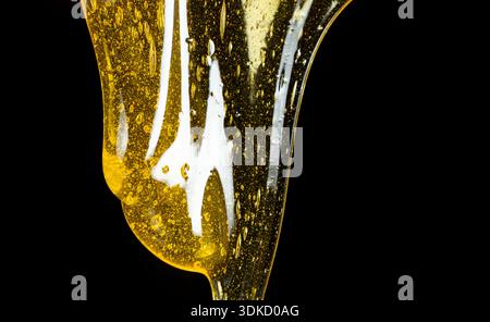Flowing golden honey with air bubbles texture Stock Photo