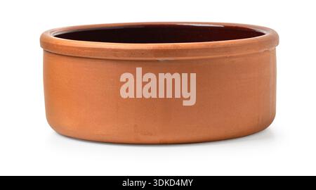 Terracotta clay bowl with a brown glazed interior, reflecting rustic kitchenware aesthetics Stock Photo