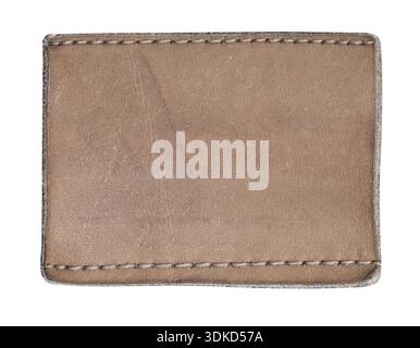 Brown leather patch with visible stitching, offering a customizable apparel label mockup Stock Photo