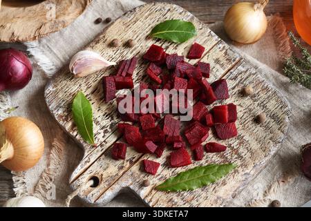 Sliced red beet root with garlic, bay leaf, onion and allspice Stock Photo