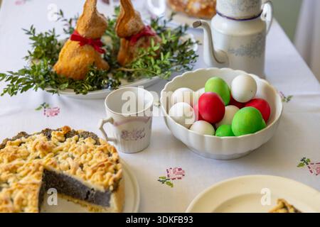 Traditional Czech Easter table presenting various holiday sweets and colored eggs Stock Photo