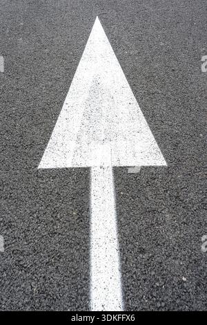 Street signs on the road. Arrow pointing forward, direction indicator Stock Photo