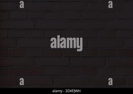 Black brick wall, dark background for design. Part of black painted brick wall. Empty Stock Photo