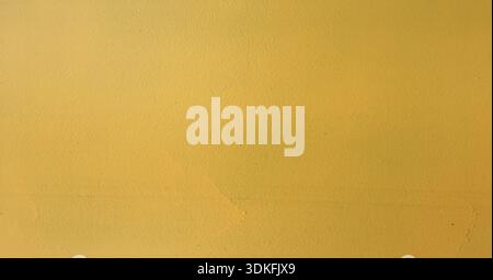 Rusty yellow painted steel metal. Stained rusty painted metal surface with flakes Stock Photo