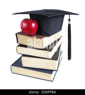 Black graduate hat, stack of big books and red apple, isolated on white background Stock Photo