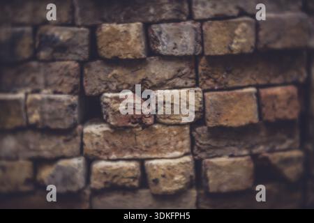 Soft - focus picture of a pile of old bricks gathered from a fallen wall in the garden Stock Photo