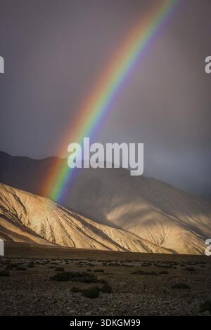 Colorful rainbow over mountains in Western Tibet Stock Photo