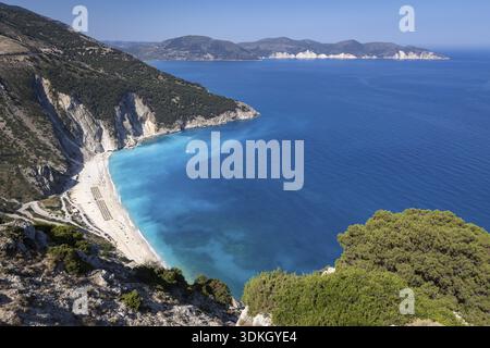 Myrthos Beach overlooking deep blue sea and steep cliffs, Myrthos Beach, Kefalonia, Greece Stock Photo