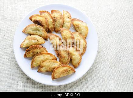 Japanese Fried Dumplings, the half moon-shaped dumplings served in Asian restaurants as an appetiser or side dish, pork and vegetable filling Stock Photo