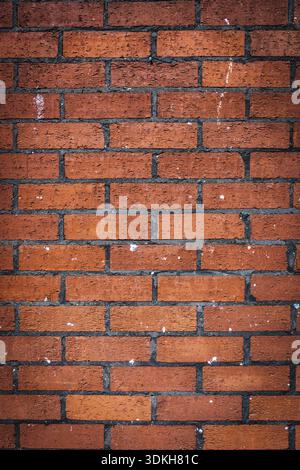 Vertical pattern of a red bricks wall Stock Photo