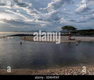 Niteroi, RJ, Brazil- 16 Dec 2025. People enjoying a beach the Itaipu lagoon sunset. Stock Photo