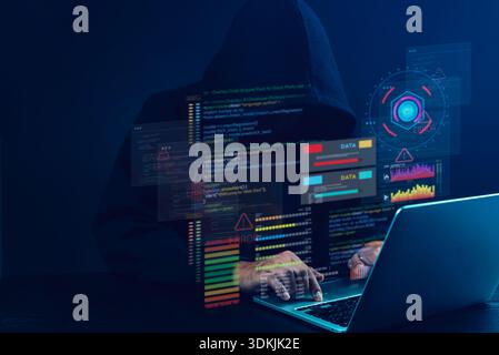 Hacker in hoodie using laptop with digital code, data errors, and cyber attack interface, representing cybersecurity breach, hacking, and online data Stock Photo