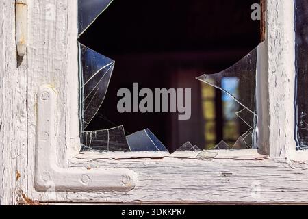 Glass shard in an old window Stock Photo