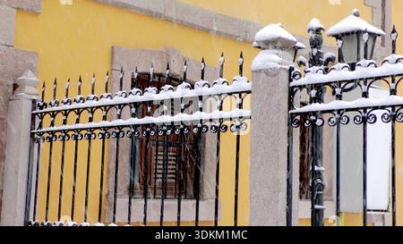 snow on the railings of the stone building Stock Photo