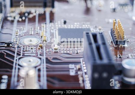Close-up view of a computer motherboard with intricate circuitry and a central processor chip Stock Photo