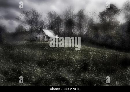 An atmospheric black&white view of a dilapidated American barn and field in Georgia,USA. Stock Photo