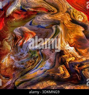 A graphic abstract image of multicolored rock with vivid textures and swirling patterns. Stock Photo