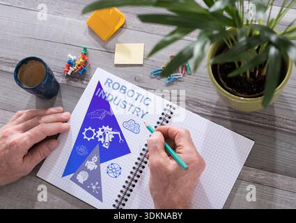 Robotic industry concept drawn on a notepad placed on a desk Stock Photo