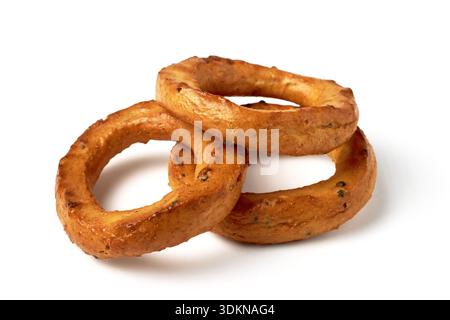 Three salted pretzels with poppy seeds isolated on a white background. Stock Photo