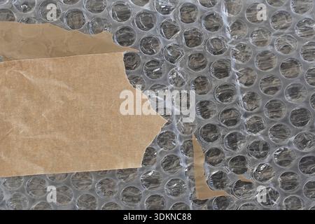 Bubble wrap plastic and adhesive tape background texture with copyspace. Stock Photo