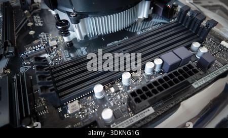Sarajevo, Bosnia and Herzegovina – January 25, 2026: Motherboard with four empty RAM slots during PC assembly, illustrating increased memory costs and Stock Photo