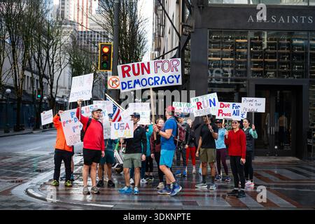 Seattle, USA. 1st Feb, 2026. A group of runners out with signs in the ...