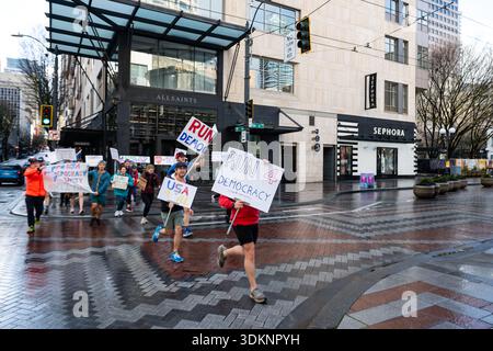 Seattle, USA. 1st Feb, 2026. A group of runners out with signs in the ...
