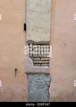 A random weathered brick wall in Rome, Italy Stock Photo