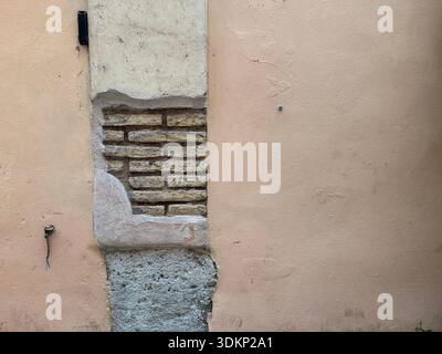 A random weathered brick wall in Rome, Italy Stock Photo