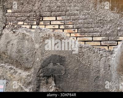 A random weathered brick wall in Rome, Italy Stock Photo