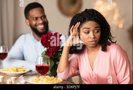 Black Woman On Unsuccessful Date In Restaurant Stock Photo