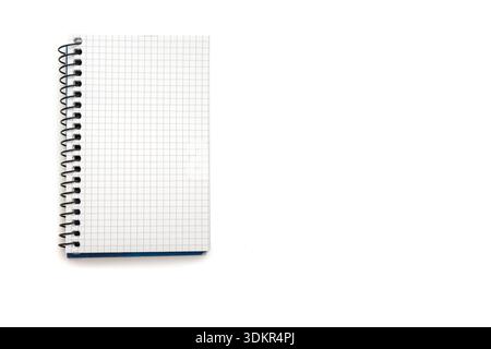 A spiral bound notebook with grid paper ideal for notes, calculations, and quick sketches. Great for students, professionals, and planners seeking org Stock Photo