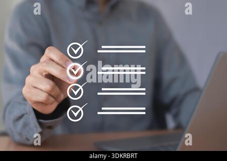 checklist Complete the performance review digital form checklist.business people using evaluation questionnaire evaluation Stock Photo