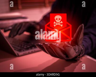 Online scam and phishing concept with hacker wearing gloves using laptop and spreading malicious email or SMS messages. Cyber crime warning, fraud att Stock Photo