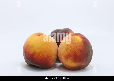 ripe peaches isolated on white Stock Photo
