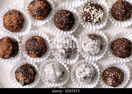Homemade healthy energy raw vegan balls varieties with cocoa seeds nuts. Different coatings including powdered sugar sesame seeds cocoa powder. Top vi Stock Photo