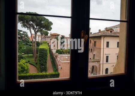 View of Roman Garden Through Window Stock Photo