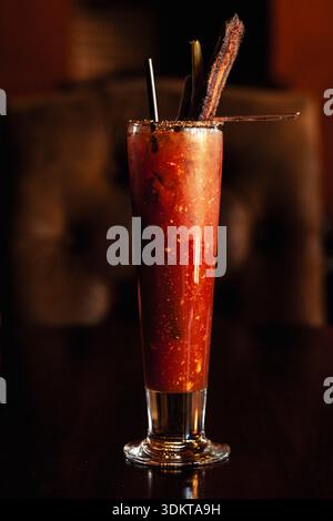 Fancy Bloody Mary in tall glass with bacon Stock Photo