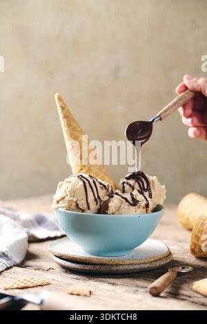 ice Cream in bowl with chocolate cream Stock Photo