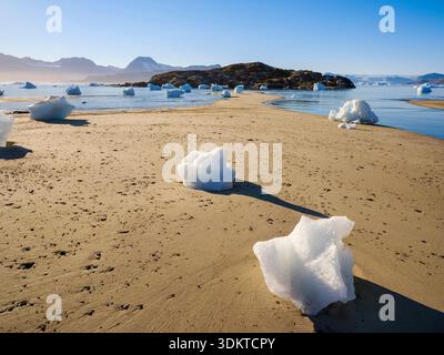 Melting ice on shore. Landscape at the Sermilik (Sermiligaaq) icefjord in the area Ammassalik in East Greenland. North America, Greenland, Ammassalik, Stock Photo