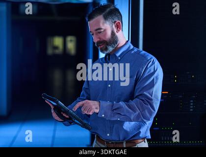 Man using tablet in data center Stock Photo