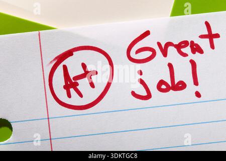 Close-up of A+ grade on lined paper Stock Photo
