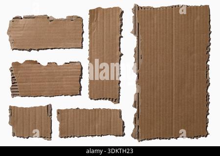 Pieces of torn cardboard on white background Stock Photo