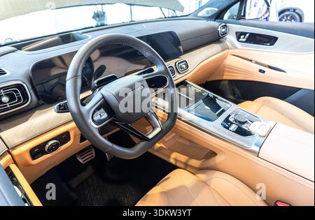 Samara, Russia - April 19, 2025: Interior design of new Jaecoo J8 vehicle, control board, steering wheel, seats Stock Photo