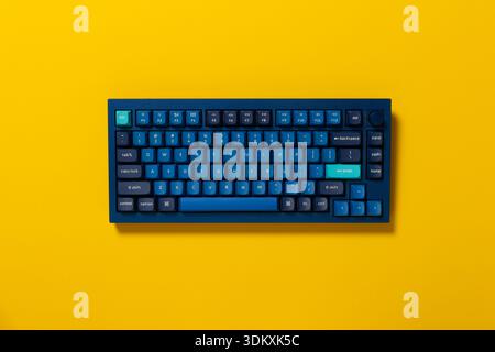 Overhead view of a mechanical keyboard on colourful background Stock Photo
