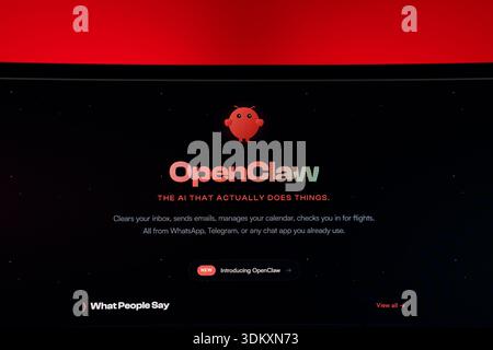 Website homepage for OpenClaw, an AI assistant tool, featuring a red robot mascot on a dark background. High quality photo Stock Photo