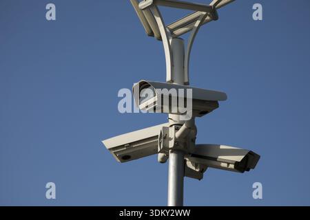 Security camera record live, Security camera on blue sky background Stock Photo