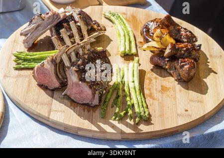 Lamb chops cooked on the grill and fresh herbs Stock Photo