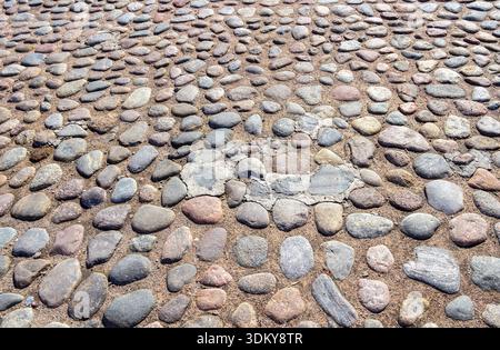 Old cobblestone pavement as creative background texture Stock Photo
